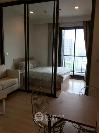 Modern studio apartment with glass partition and city view
