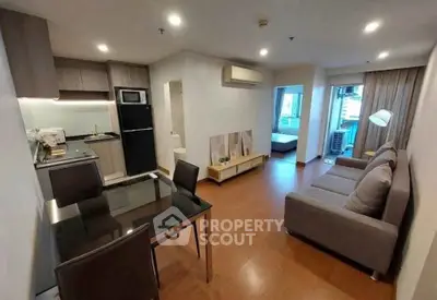 Modern open-plan living room with kitchen in stylish apartment