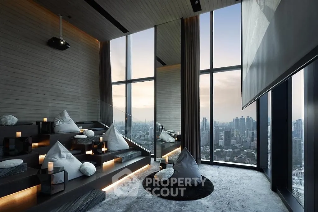 Luxurious high-rise living room with panoramic city views and modern decor.
