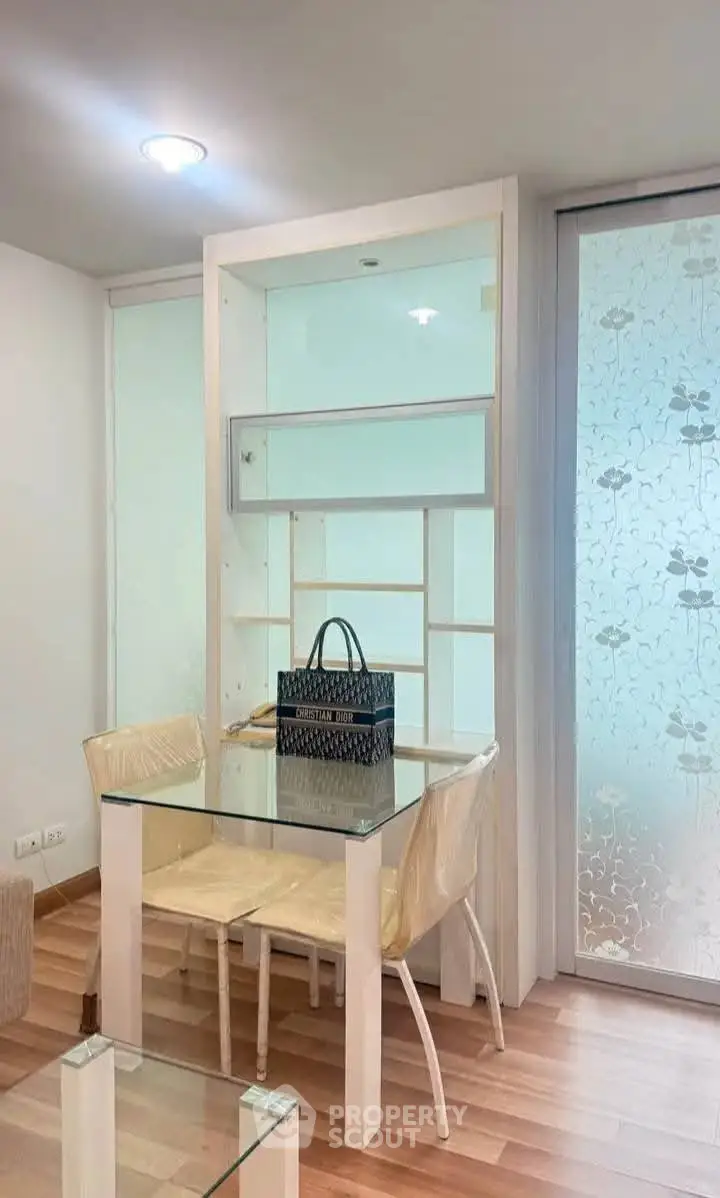 Modern dining area with glass table and stylish decor