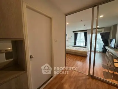 Modern bedroom with wooden flooring and large windows in a stylish apartment