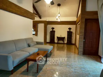 Spacious living room with elegant furniture and high ceilings