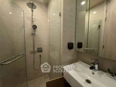 Modern bathroom with glass shower and sleek sink design