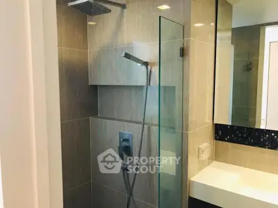 Modern bathroom with sleek shower design and elegant fixtures.