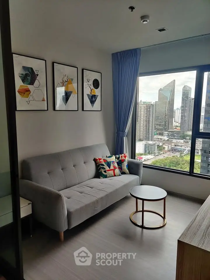Modern living room with stylish decor and city view from large window