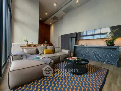 Luxurious modern living room with open kitchen and stylish decor