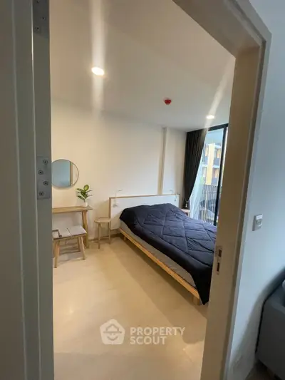 Modern bedroom with minimalist decor and balcony view