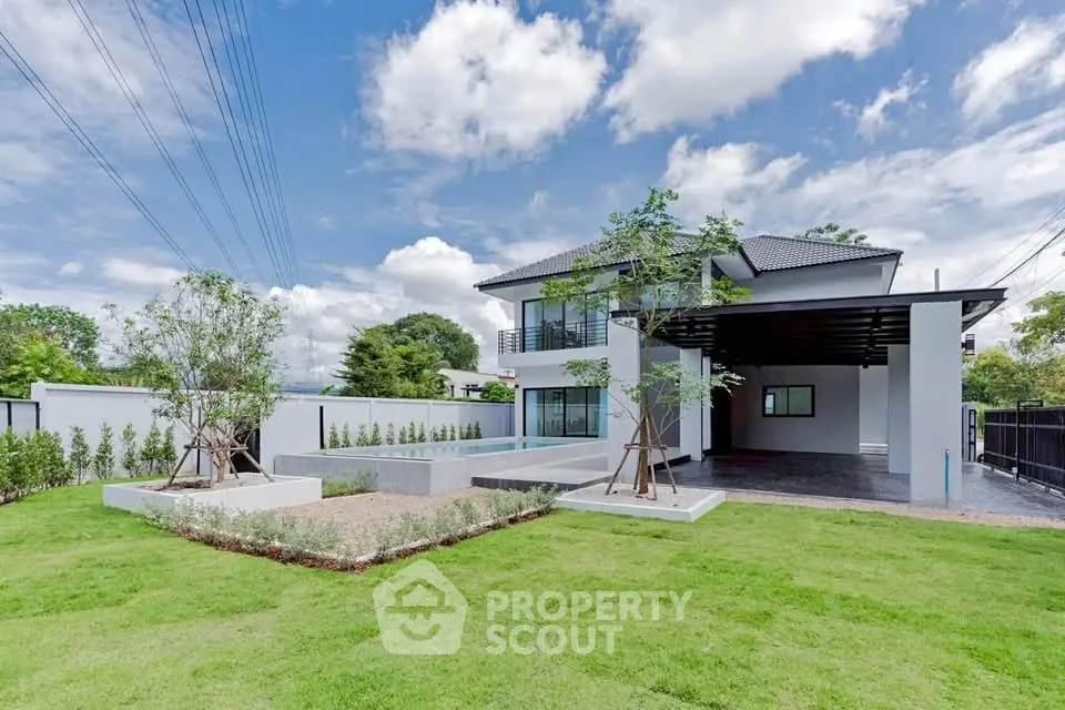 Stunning modern house with lush green lawn and spacious driveway, perfect for family living.