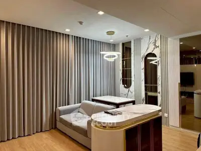Luxurious modern living room with elegant marble accents and stylish lighting