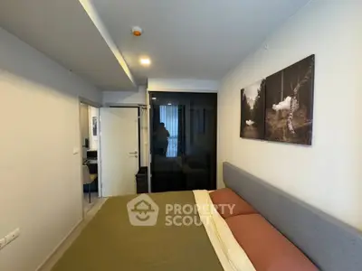 Modern bedroom with stylish decor and cozy ambiance in a contemporary apartment.