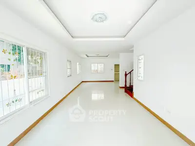 Spacious and bright living room with large windows and modern design