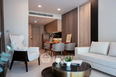 Modern living room with elegant furniture and open kitchen layout