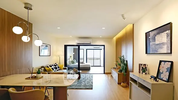 Modern living room with stylish decor and open layout, featuring elegant lighting and cozy seating area.