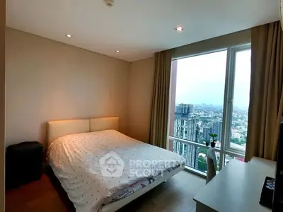 Modern bedroom with city view and natural light