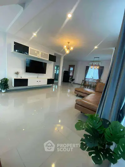 Spacious modern living room with sleek design and elegant lighting