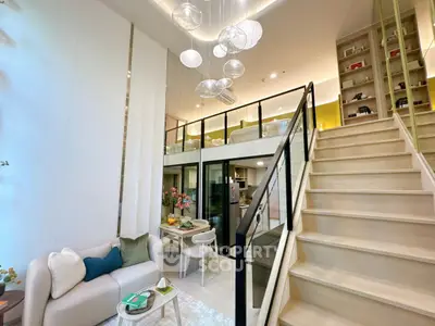 Modern loft apartment with stylish living area and elegant staircase