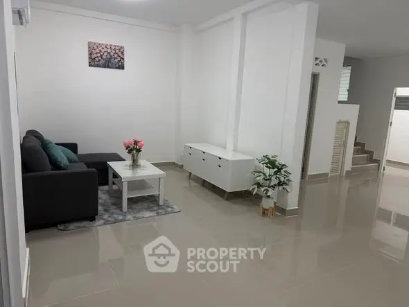 Spacious modern living room with sleek furniture and elegant decor