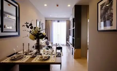 Modern living room with elegant dining setup and stylish decor