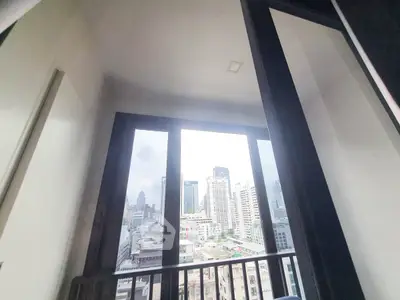 Stunning city view from a high-rise balcony, perfect for urban living.