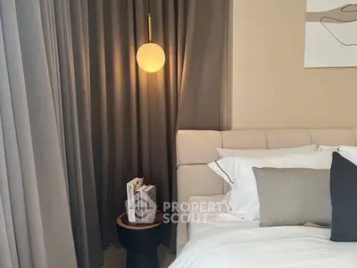 Cozy bedroom with modern lighting and elegant decor