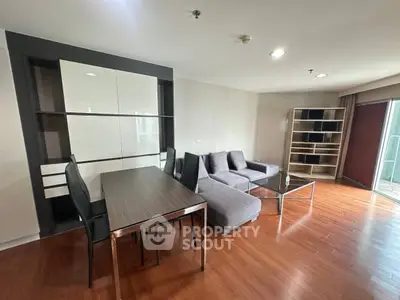 Spacious modern living room with sleek furniture and wooden flooring