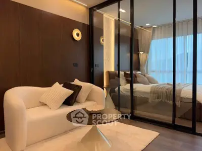 Luxurious modern bedroom with elegant decor and cozy seating area