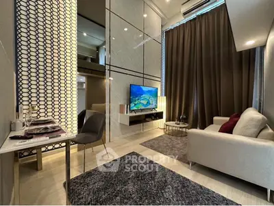 Modern living room with high ceiling, stylish decor, and cozy seating area in a contemporary apartment.
