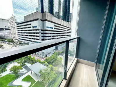 Modern balcony with city view in high-rise building, perfect for urban living.