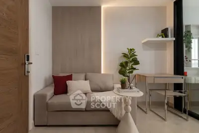 Modern living room with cozy sofa, stylish decor, and elegant lighting in a contemporary apartment.