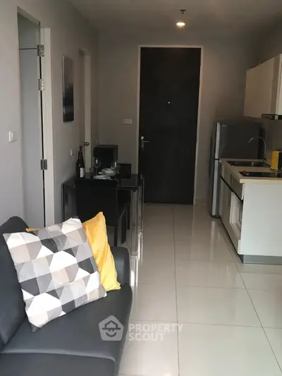 Modern apartment interior with sleek kitchen and cozy living area