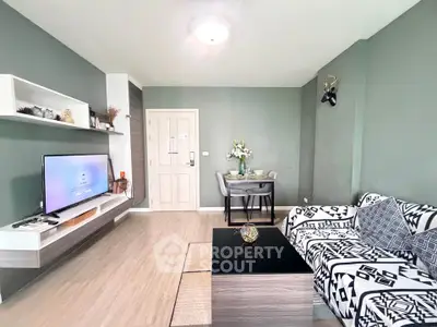 Stylish living room with modern decor and cozy seating area, perfect for relaxation and entertainment.