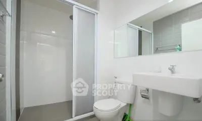 Modern bathroom with sleek shower and minimalist design in a contemporary home.
