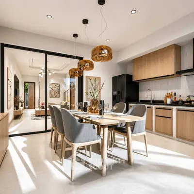 Modern open-layout kitchen and dining area with stylish lighting and wooden accents.
