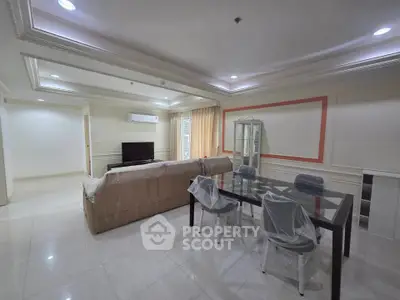Spacious living room with modern furniture and elegant decor in a luxury apartment.