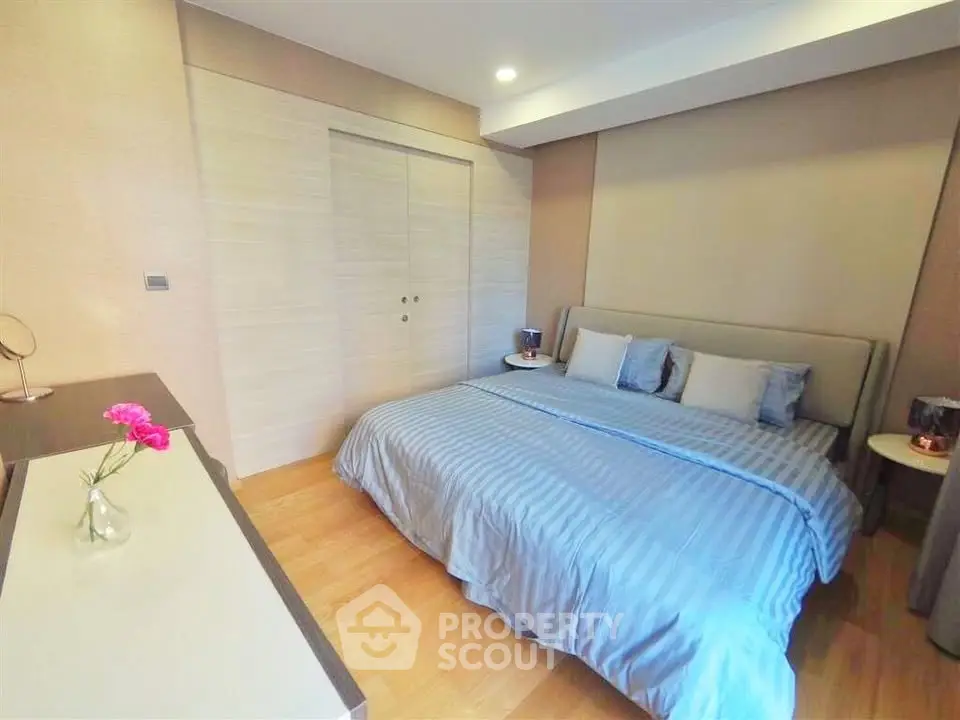 Spacious bedroom with modern decor and cozy ambiance