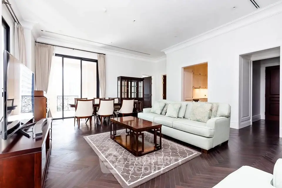 Spacious and elegant living room with modern furniture and large windows in a luxury apartment.