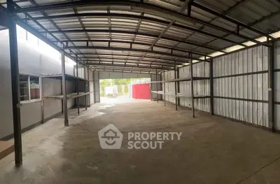 Spacious industrial warehouse with metal roofing and ample storage space