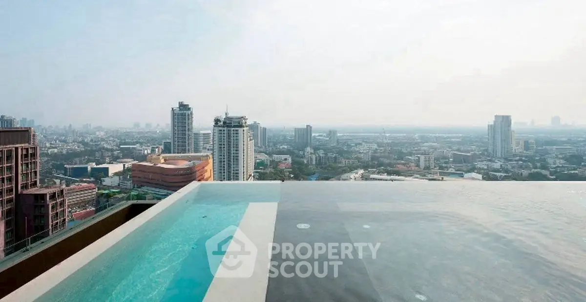 Stunning rooftop infinity pool with breathtaking city skyline view