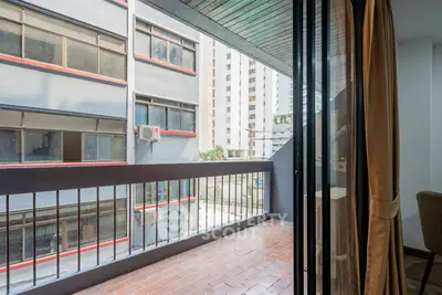 Spacious balcony with urban view in modern apartment