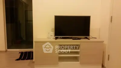 Modern living room with sleek TV stand and flat-screen TV, perfect for cozy entertainment nights.