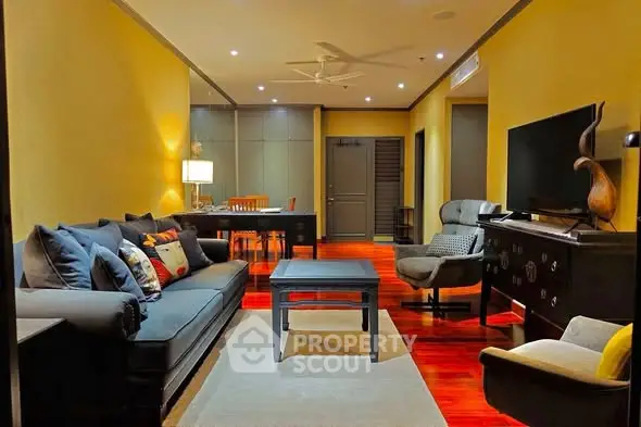 Luxurious living room with elegant furniture and warm lighting, perfect for relaxation and entertainment.