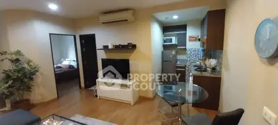 Modern apartment living room with open kitchen and stylish decor