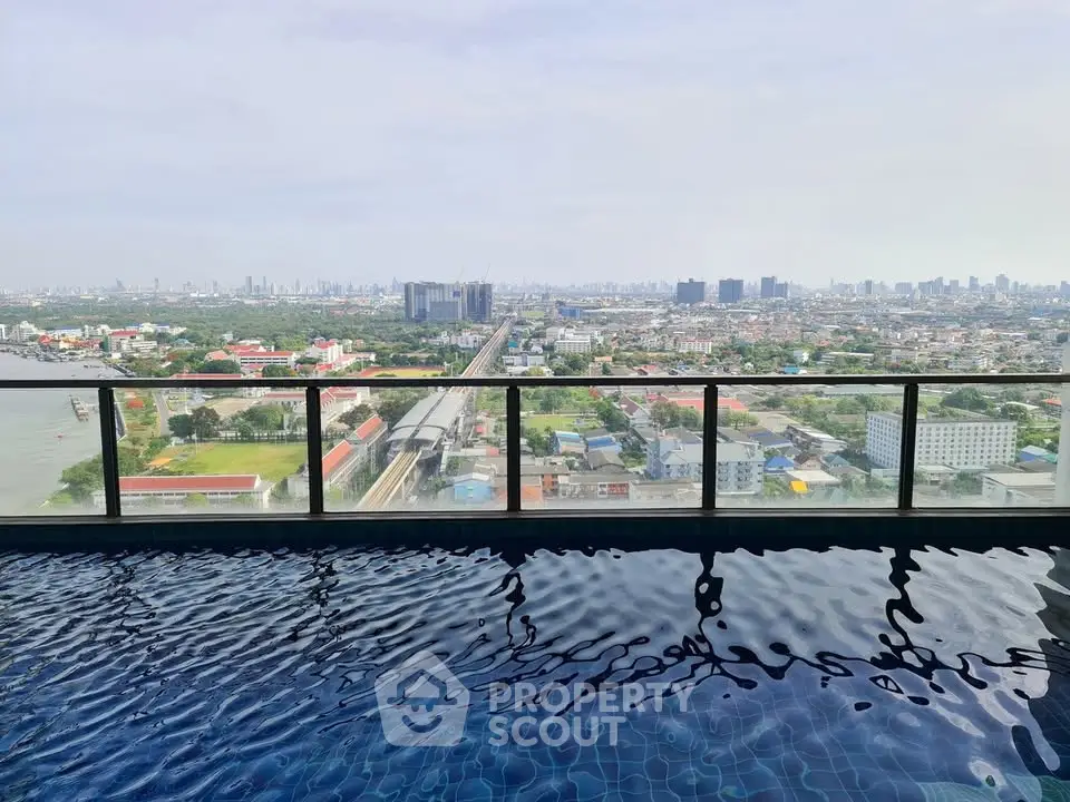 Stunning rooftop pool with panoramic city skyline view, perfect for luxury urban living.