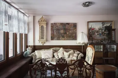 Charming vintage living room with elegant decor and cozy seating area.