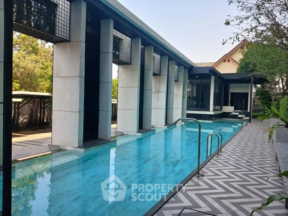 Luxurious outdoor pool with modern design and elegant surroundings