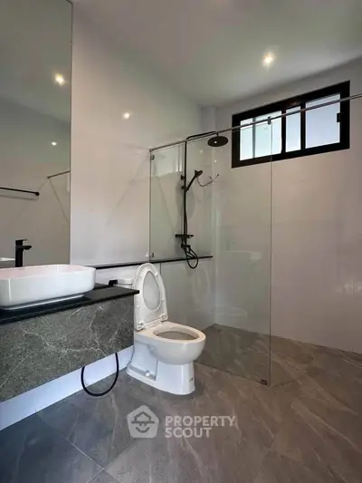 Modern bathroom with sleek design and glass shower enclosure