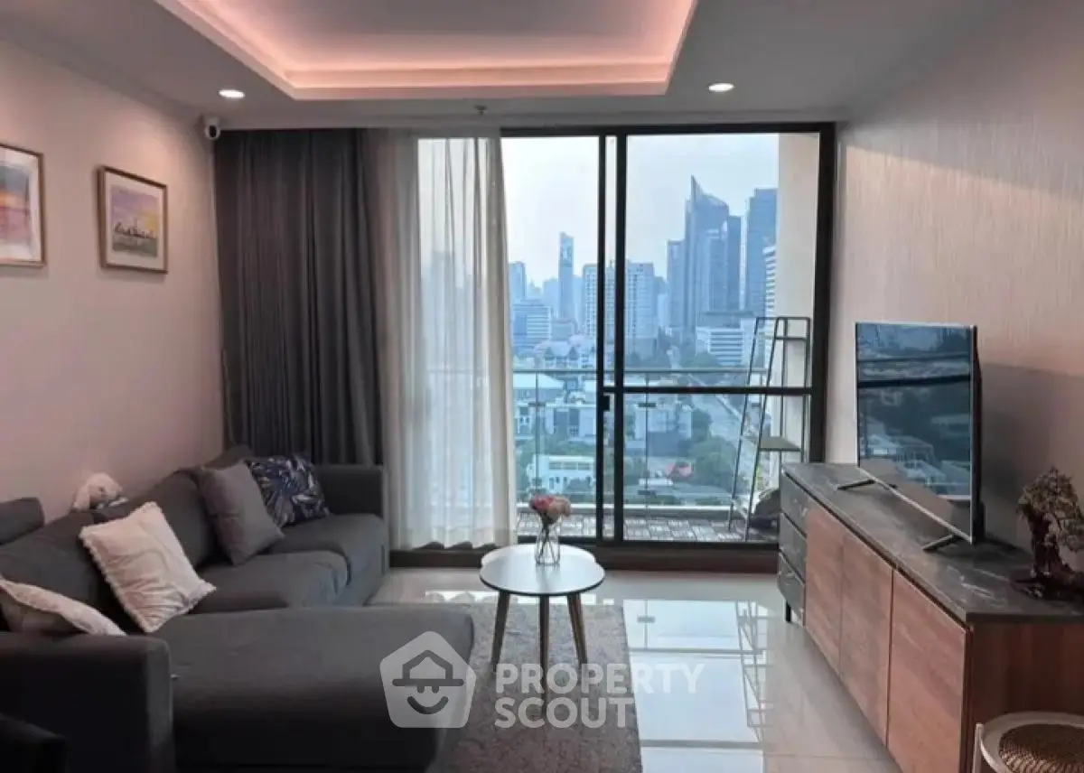 Modern living room with city view, stylish decor, and cozy ambiance.