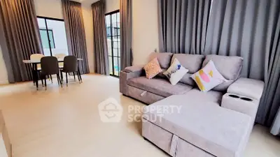 Spacious modern living room with elegant decor and ample natural light
