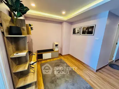 Modern living room with stylish decor and wooden flooring