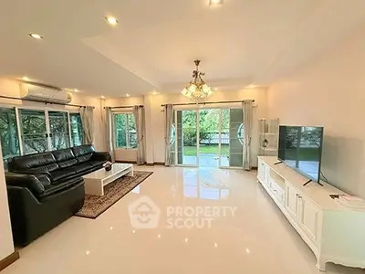 Spacious living room with modern decor and large windows for natural light.